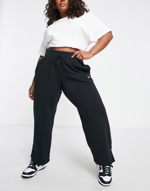 Nike Plus mini swoosh high rise wide leg joggers in black and sail