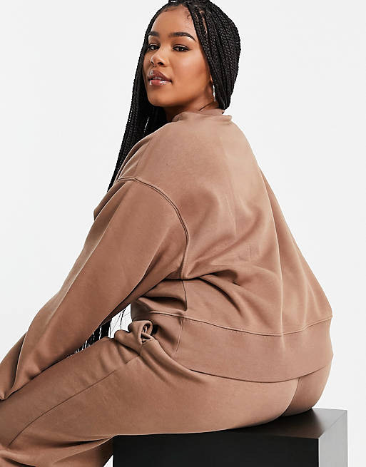 Women Nike Plus mini swoosh oversized boxy sweatshirt in earth brown 