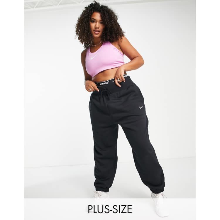 Nike Plus mini swoosh oversized high rise joggers in black and