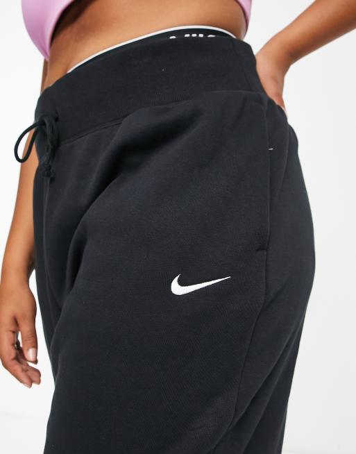 Nike Plus mini swoosh oversized high rise joggers in black and sail