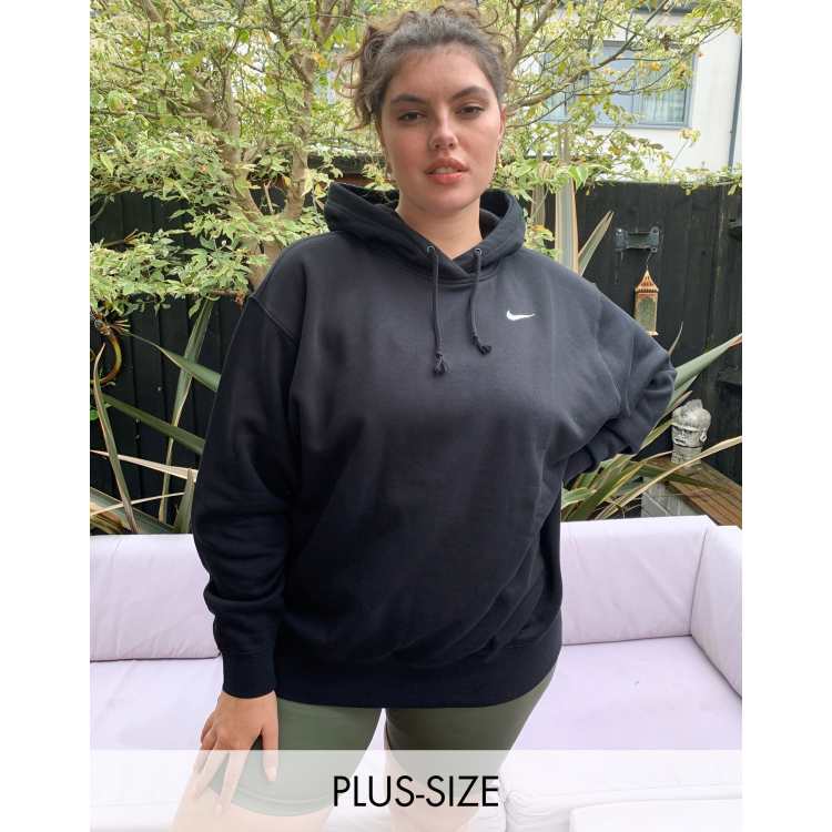 Nike Plus mini swoosh oversized hoodie in black ASOS