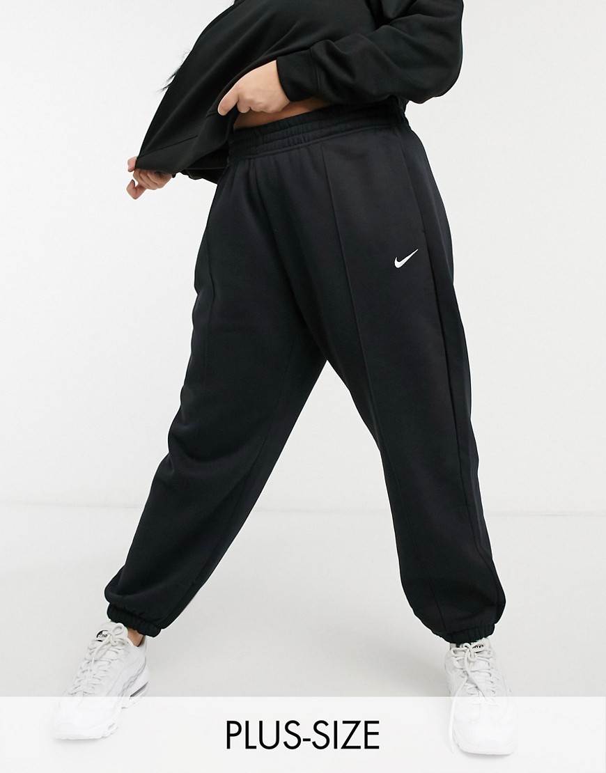 Plus-size joggers by Nike This item is excluded from promo Elasticated waist Side pockets Nike logo embroidery to leg Seam details Elasticated cuffs Oversized tapered fit A roomy cut around the thigh with a narrow shape through the leg