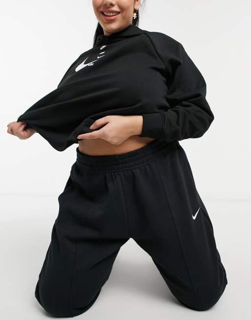 Nike Plus mini swoosh oversized jogger in black