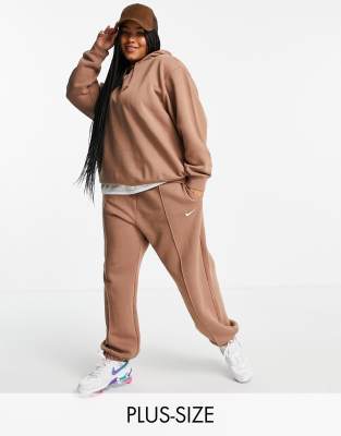 nike mini swoosh oversized joggers in tawny brown