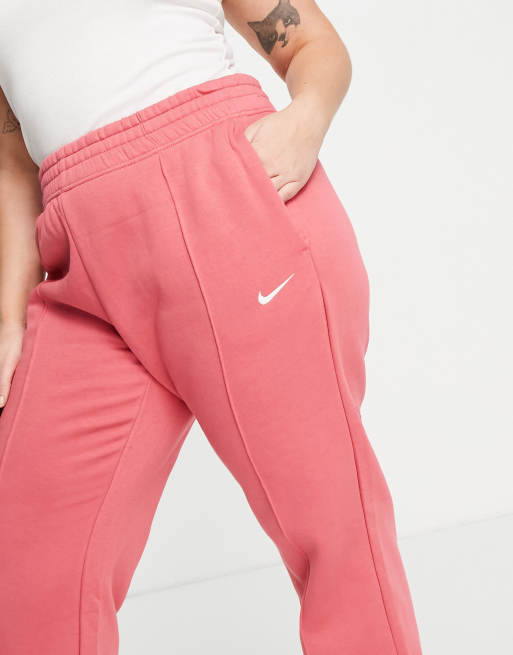 Nike Plus mini swoosh oversized joggers in archaeo pink