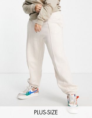 Nike Plus mini swoosh oversized joggers in pearl white - ASOS Price Checker