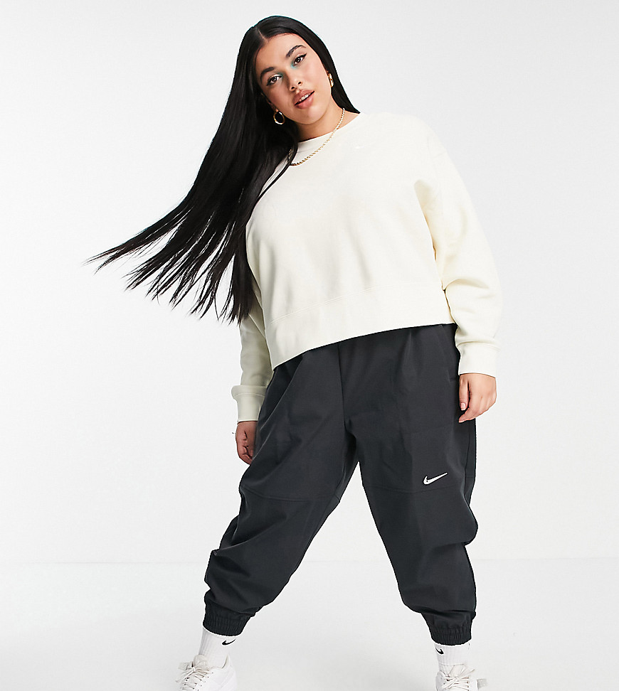 Nike Plus mini swoosh oversized sweatshirt in off white