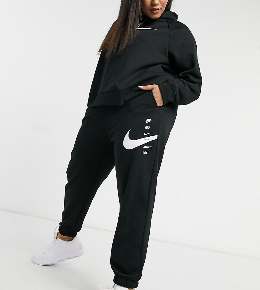 Nike Plus swoosh oversized joggers in black
