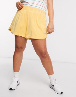 nike terry towelling shorts in yellow