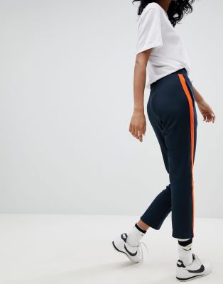 orange nike track pants