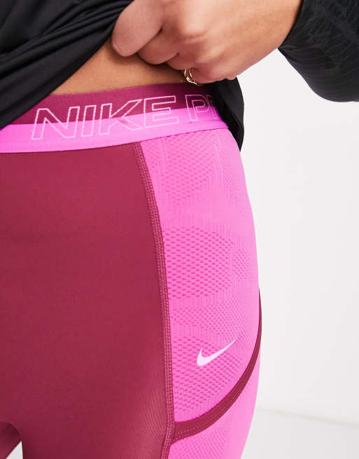 Nike Pro Femme Training dri fit high rise 7/8 leggings in purple