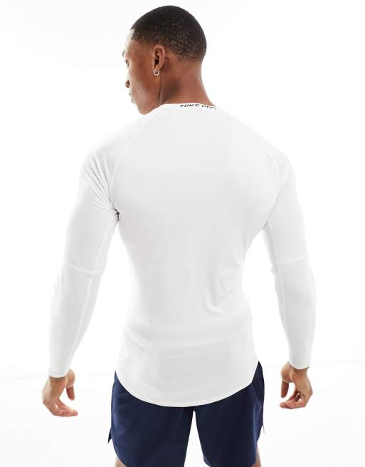 Nike Pro Haut de sport ajuste en tissu Dri FIT a manches longues Blanc