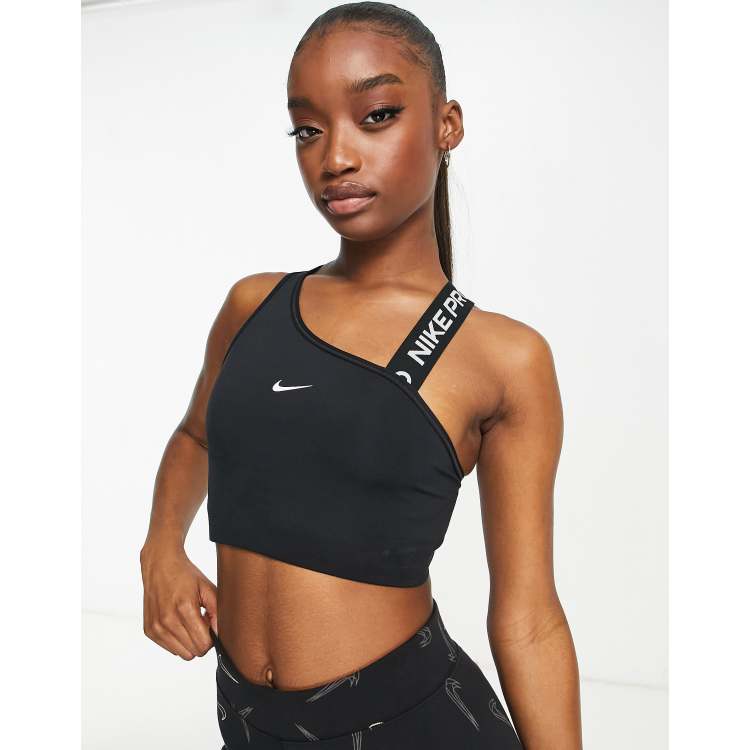 Nike Pro Training - Brassière de sport asymétrique maintien moyen en tissu  Dri-FIT avec logo virgule - Noir