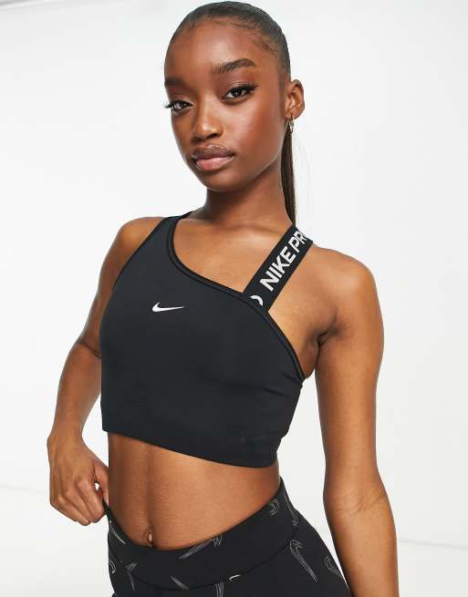 Nike Pro Training - Brassière de sport asymétrique maintien moyen en tissu  Dri-FIT avec logo virgule - Noir