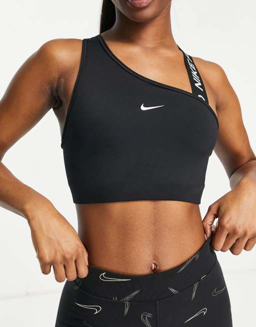 Nike Pro Training - Brassière de sport asymétrique maintien moyen en tissu  Dri-FIT avec logo virgule - Noir