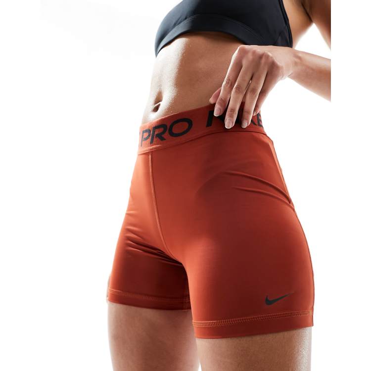 Orange on sale nike pro