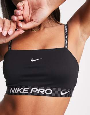 Nike Pro Training dri fit indy bandeau light support sports bra in black graphic