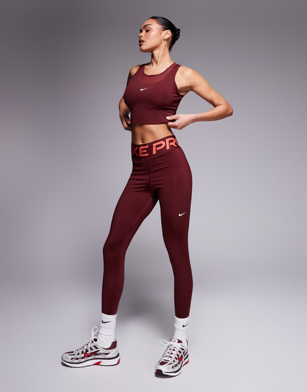 Nike Pro Training Dri-FIT Sculpt high waisted leggings in burgundy