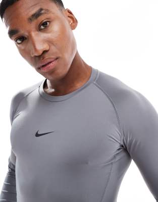 Nike Training Nike Pro Training Dri-FIT slim fit long sleeve top in dark grey