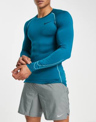 Nike Pro Training Dri-FIT slim long sleeve top in teal - ASOS Price Checker