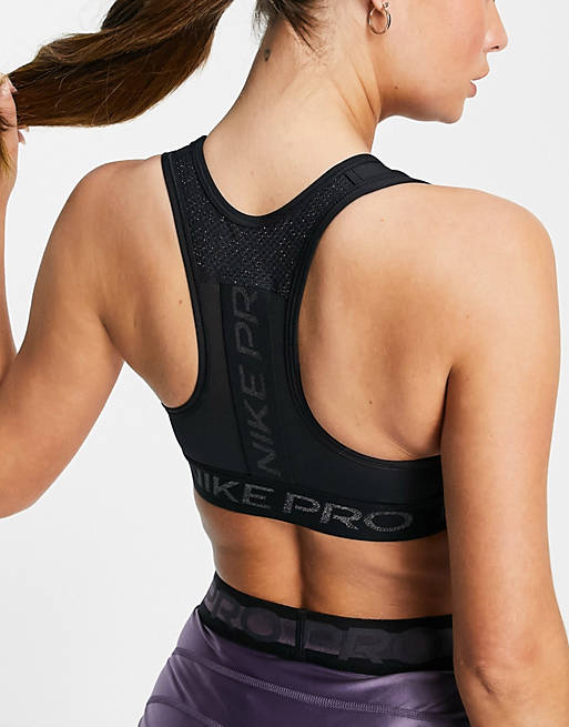 Nike Pro Training Dri-FIT Swoosh Sparkle medium support sports bra in black  | ASOS