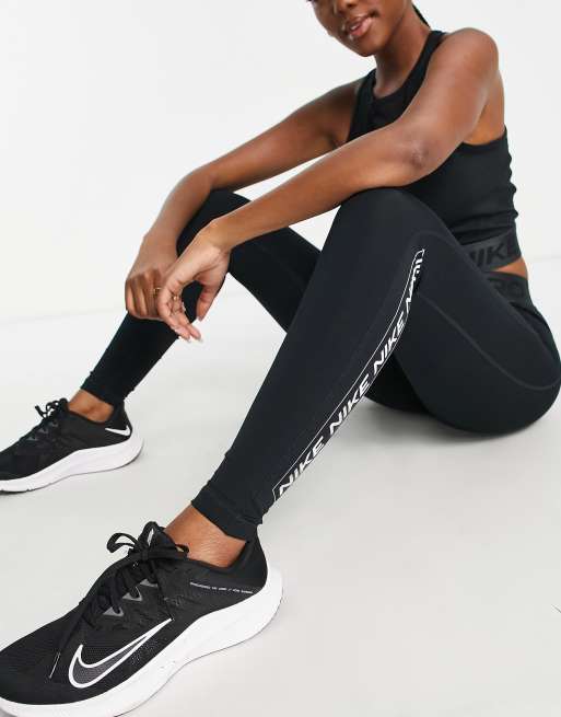 Nike Training leggings with gold sparkle trim