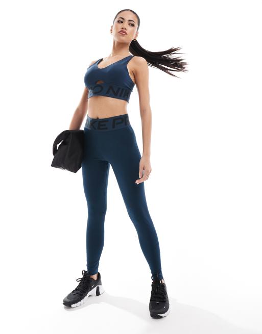 Nike Pro Training Indy medium support plunge sports bra in navy ASOS