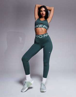 asos Nike Pro Training medium support sports bra and leggings in green