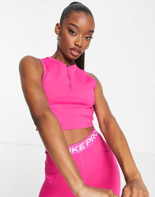 Nike Pro Training Seasonal Dri FIT cropped vest top in pink ASOS