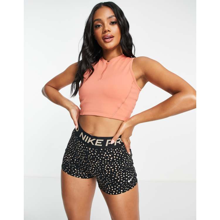 Nike Pro seasonal zip crop top in pink | ASOS