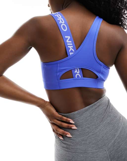 Nike Pro Training Swoosh asymmetric medium support sports bra in blue ASOS