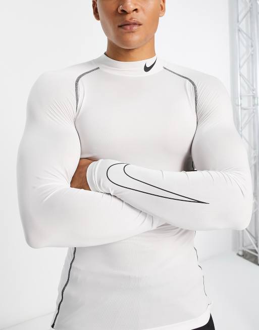 Nike Pro Training tight long sleeve mock tight top in white | ASOS