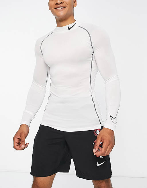 Funcionar fenómeno Chimenea Nike Pro Training tight long sleeve mock neck tight top in white | ASOS