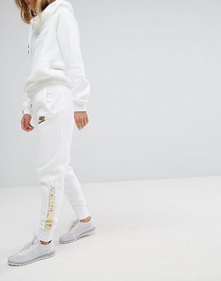 white and gold nike sweatpants
