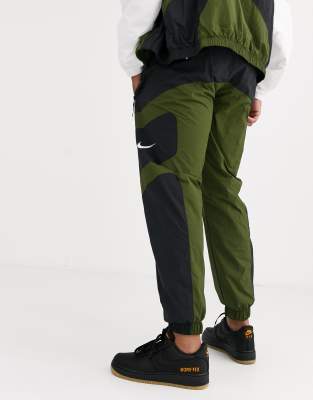 nike swoosh cuffed woven sweatpants in khaki