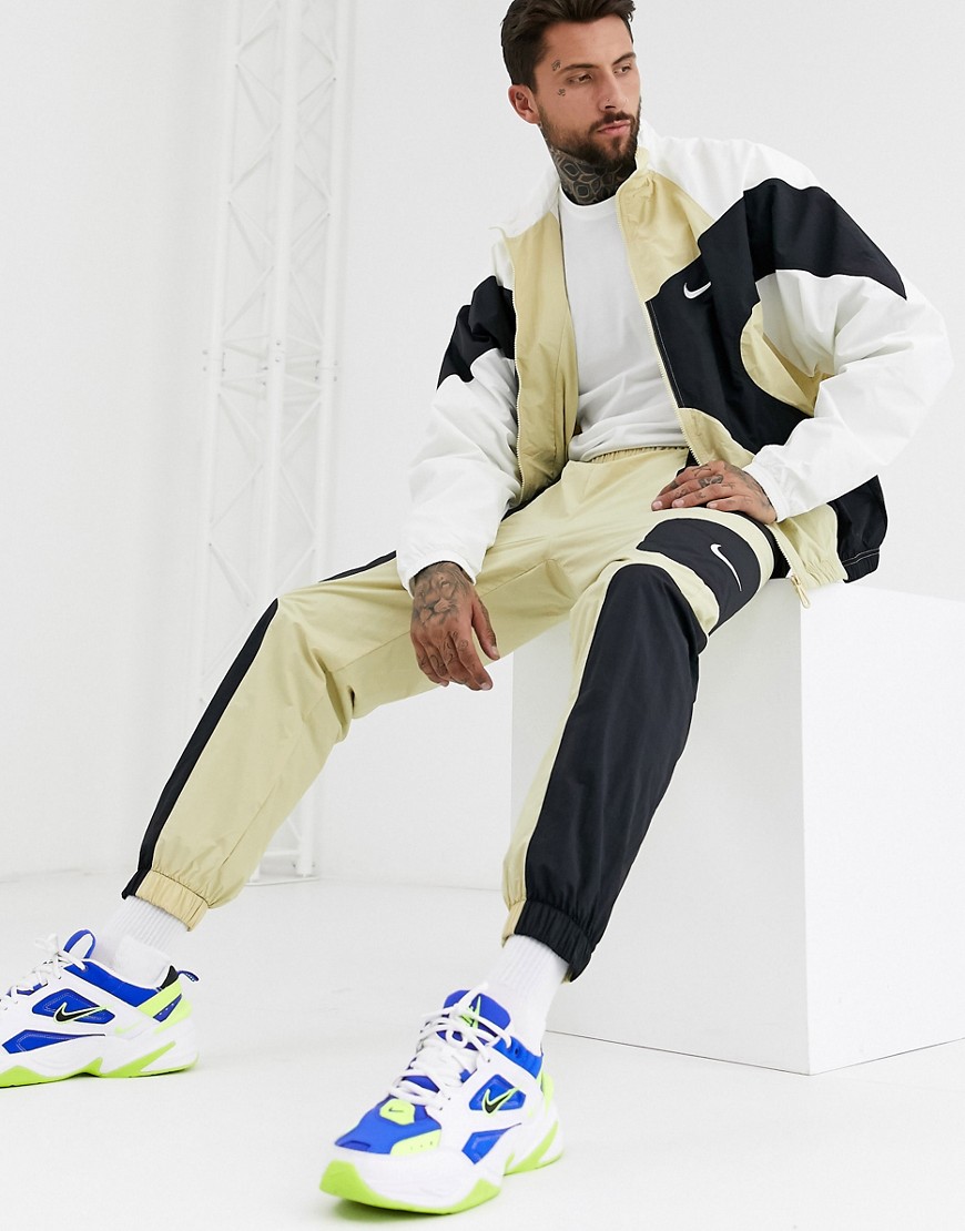 Nike – Re-Issues – Guldfärgade mjukisbyxor med muddar