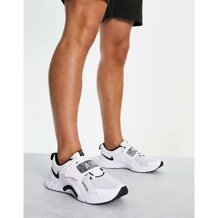 Nike Renew Retaliation 4 sneakers in white ASOS