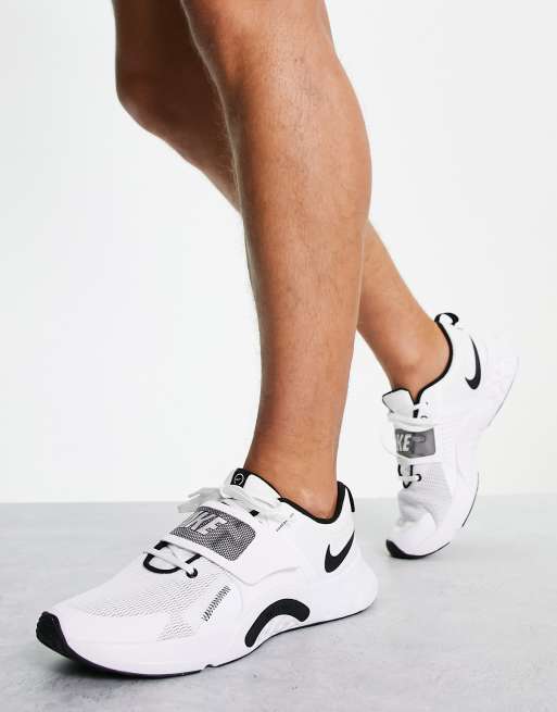 Nike Renew Retaliation 4 sneakers in white ASOS