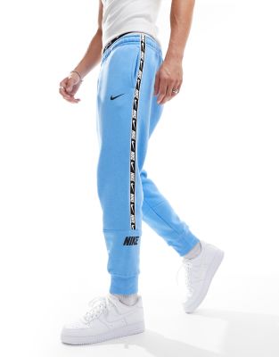 Nike Repeat logo joggers in blue