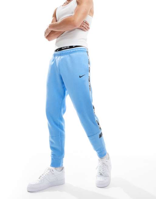 Nike Repeat logo joggers in blue