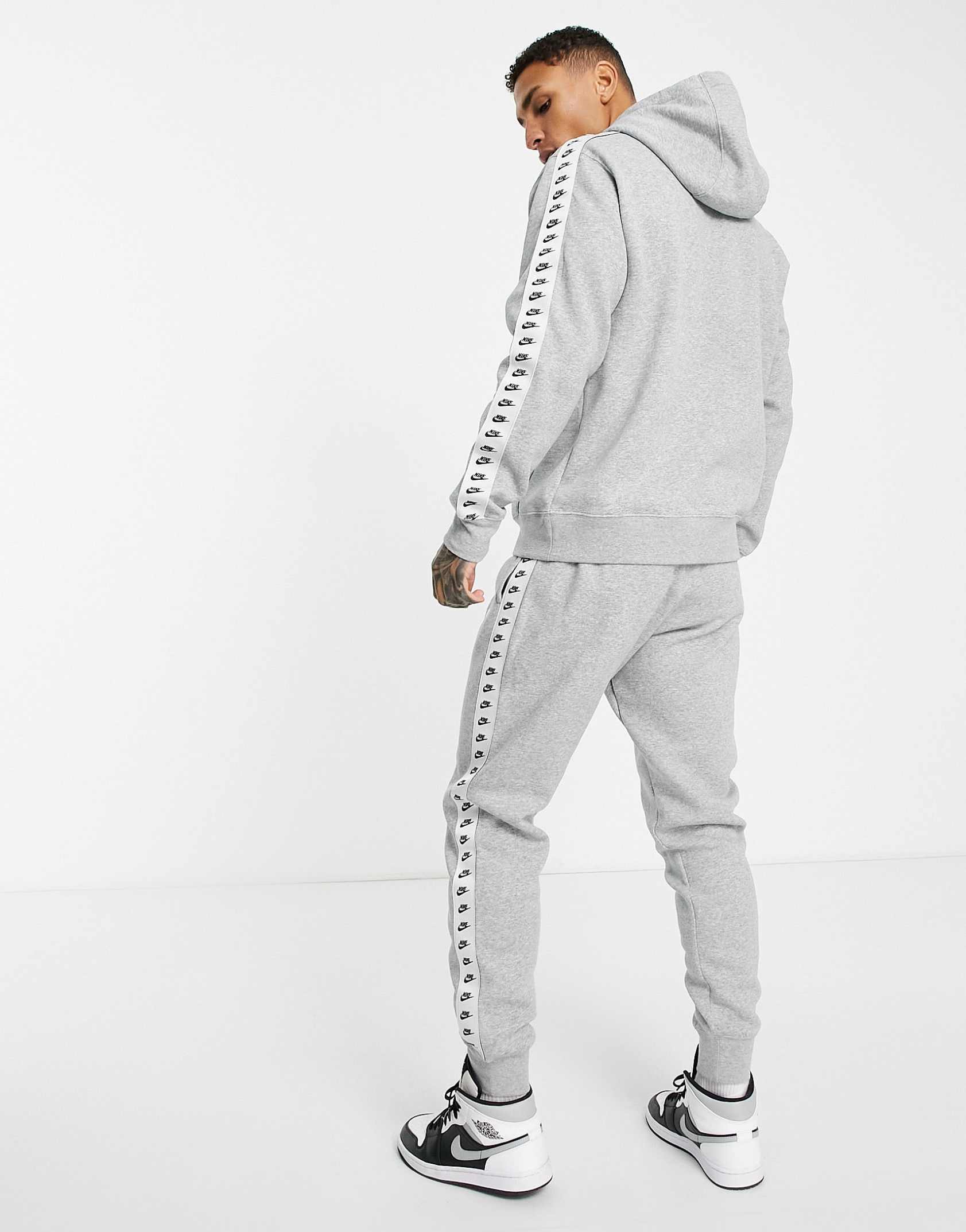 Nike Repeat logo taped fleece tracksuit set in grey ASOS Price Checker