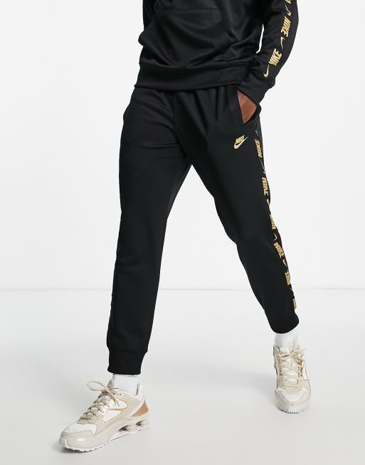 Nike Repeat logo taping joggers in black ASOS