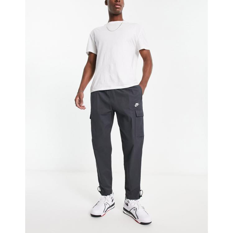 Nike repeat logo woven trousers in dark grey