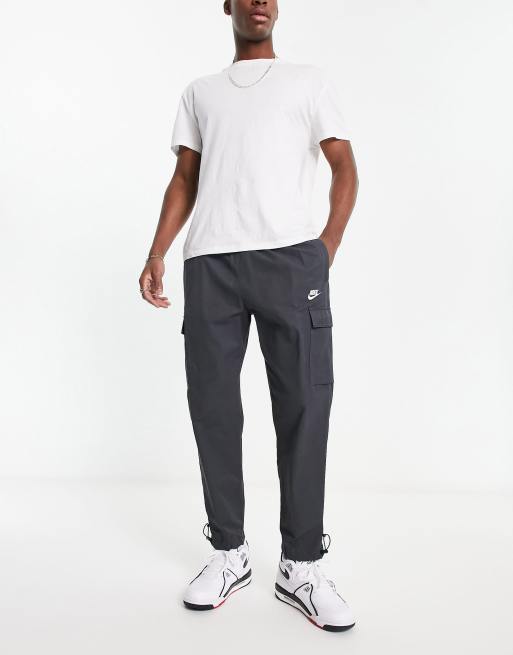 Nike repeat logo woven trousers in dark grey