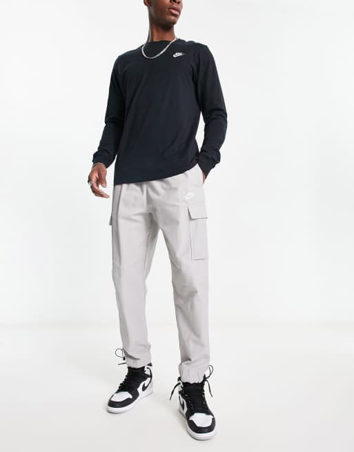 Nike repeat logo woven trousers in light grey