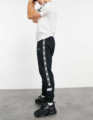 nike logo taping cuffed joggers in black