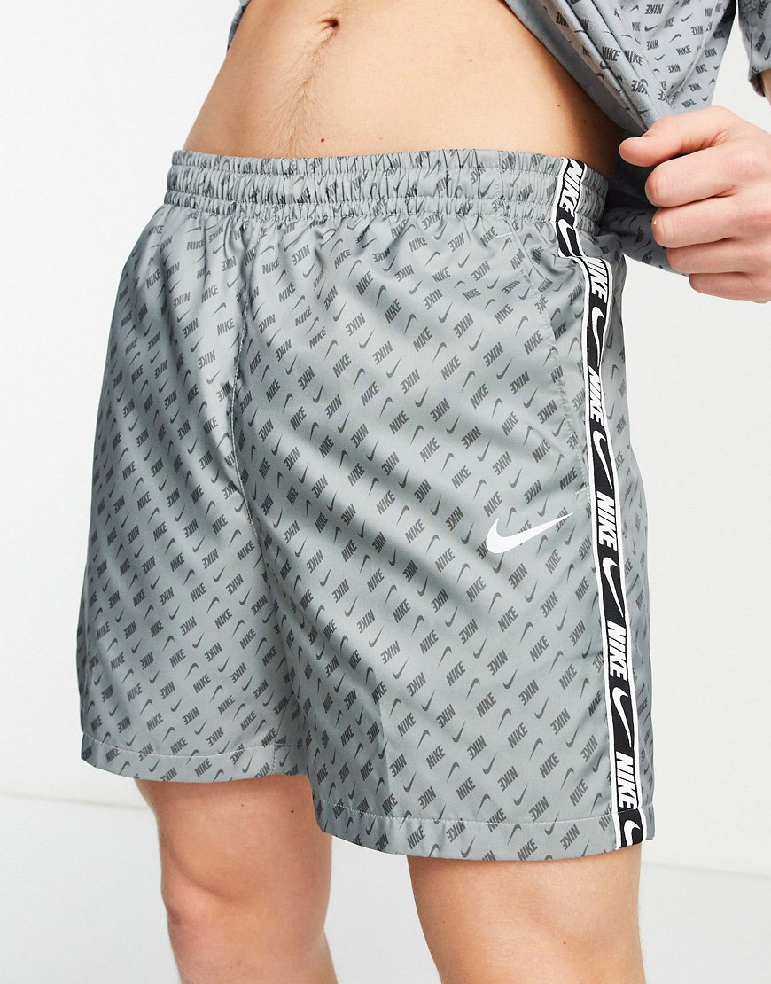 Nike Repeat Pack all over logo print woven taping shorts in grey