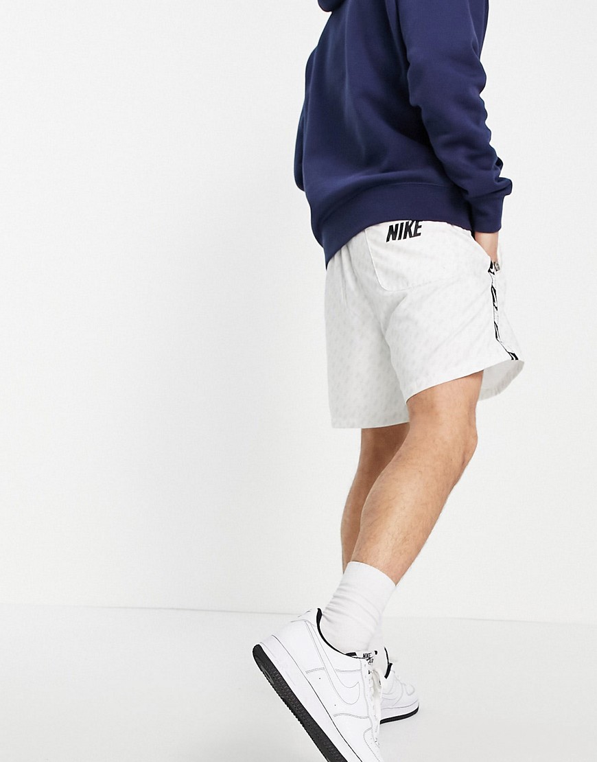 Nike Repeat Pack all over logo print woven taping shorts in white