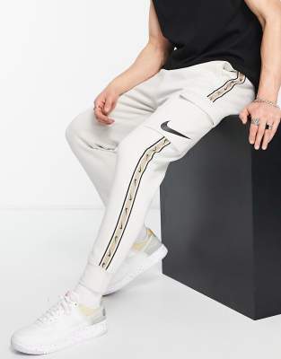 Nike repeat pack cargo joggers in rattan - ASOS Price Checker