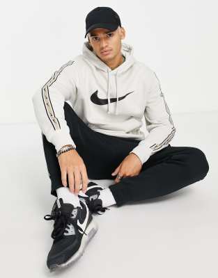 Nike repeat pack logo hoodie in beige - ASOS Price Checker